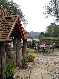 The breakfast patio and the old dairy. The Beaulieu River in the distance