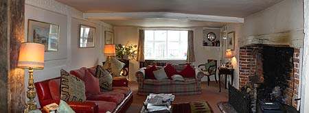 The comfortable family sitting room with open fire